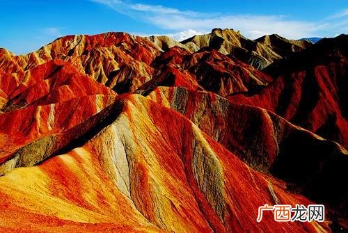 七彩丹霞成因,丹霞地貌不同颜色是什么元素？